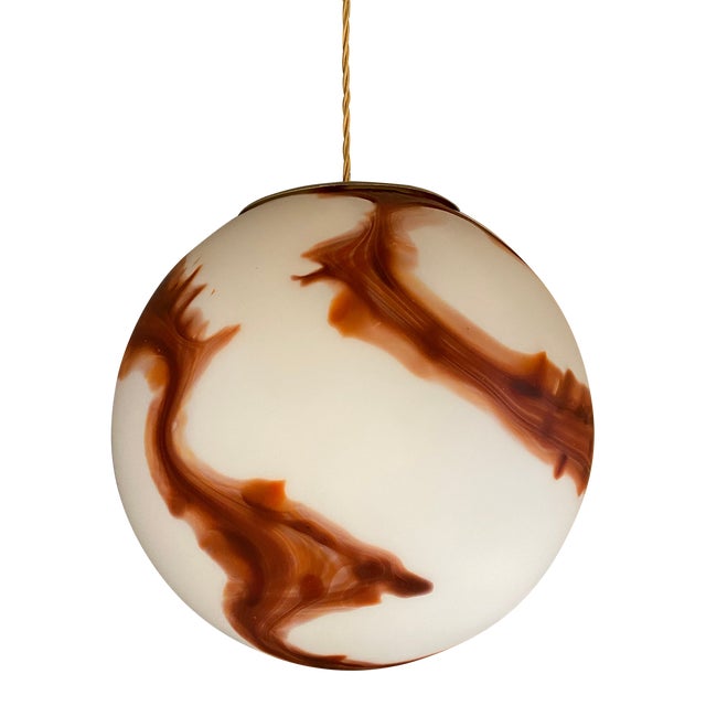 Impressive scenographic milky-white and brown Sphere in Murano Glass Design in very particular and effective movement. in style 70's. Very High Italian craftsmanship. Venetian working glass make up this scenographic suspension lamp. These jewels melted together are skillfully blown by skilled Murano masters, Ambient and shenographic interior light. Gold 24K metal frame for 1 bulb, BULB LED REQUIRED Ships from Italy. Diameter 30cm/11.8" less ALL MADE IN ITALY Hight italian craftmanship, a piece of art.